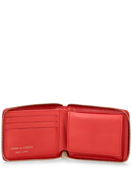 Comme des Garçons Wallet   Dot printed leather zip around wallet 